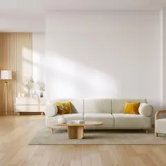 Soggiorno moderno con divano beige, poltrona, tavolino in legno e piante. Perfetto per abbinare porte e infissi con stile.