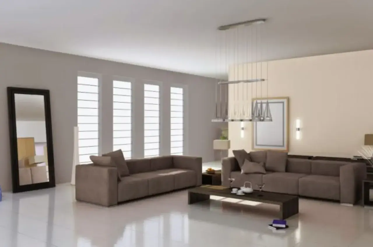 Soggiorno moderno con divani color tortora e grigio, tavolino scuro, specchio alto e grandi finestre.